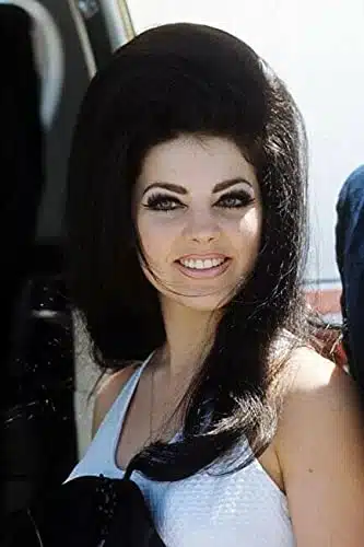 Priscilla presley smiling portrait in white dress 's with big hair xphoto